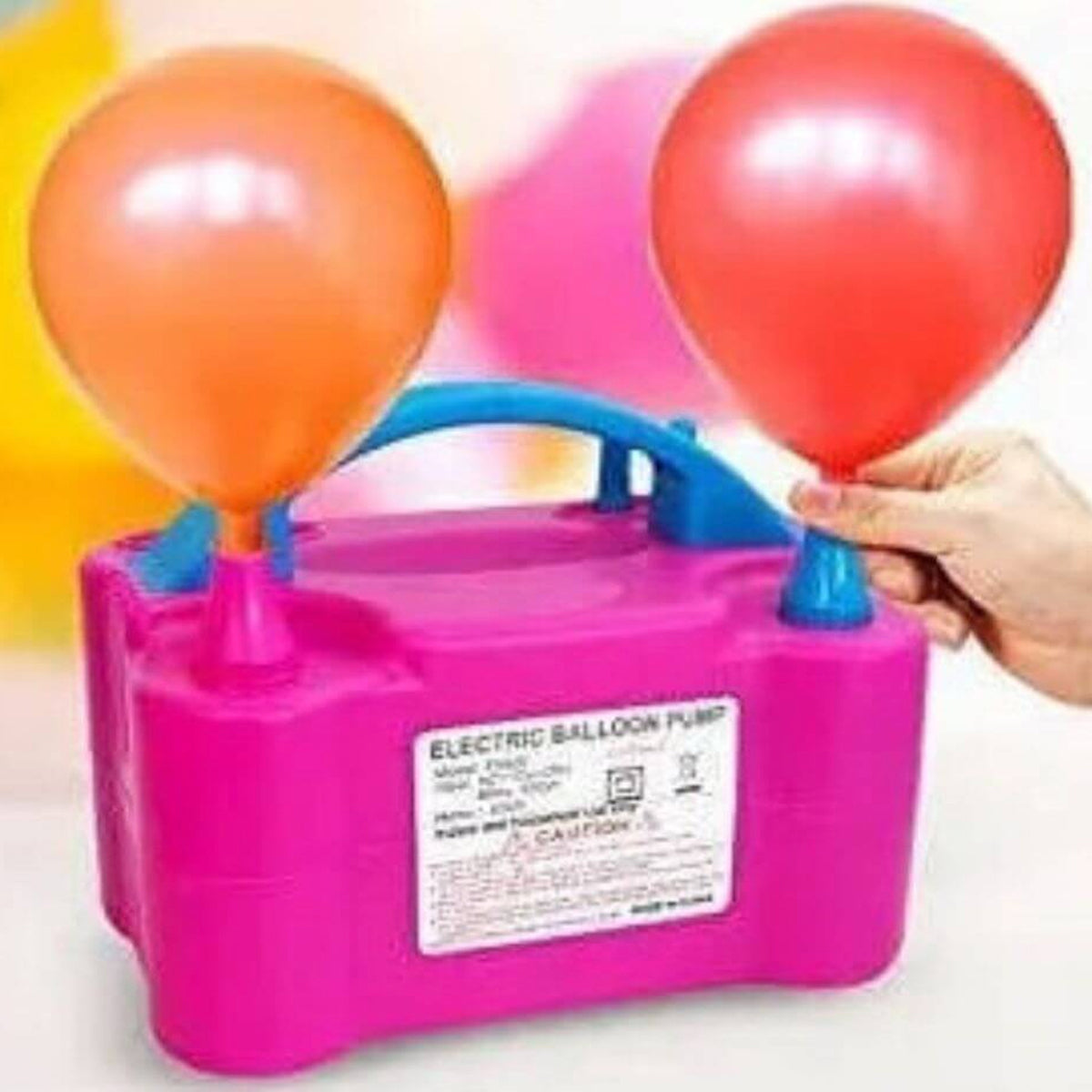 Electric balloon inflator being used at a birthday party for quick decoration setup
