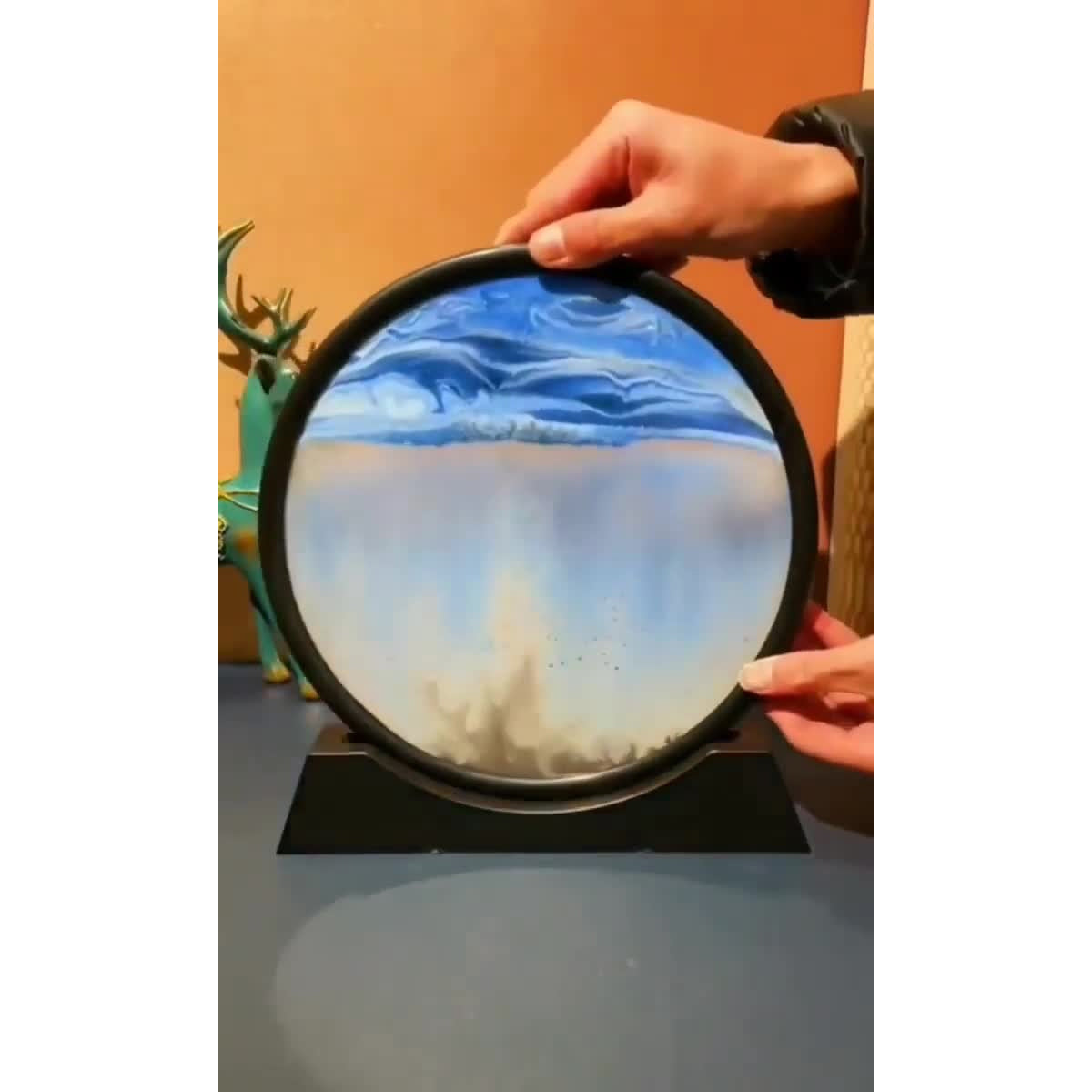 Relaxing sandscape art piece with flowing sand and scenic mountain design