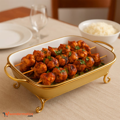 Elegant ceramic serving dish with golden stand and handles – perfect for parties and dinners