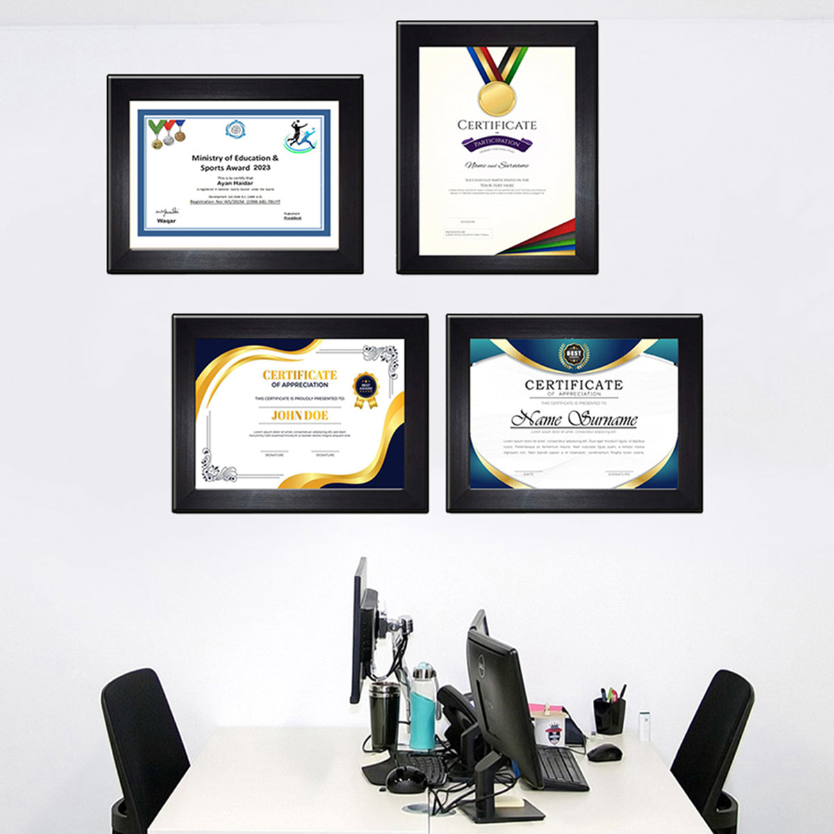A4 certificate frames mounted on wall displaying awards and documents