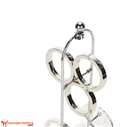 Close-up of the plastic rings and clear acrylic shield on a kinetic desk display