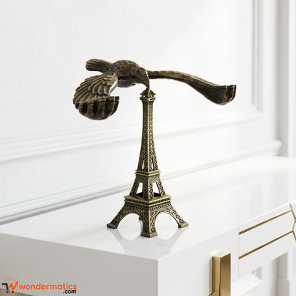 Antique eagle statue with Eiffel Tower design placed as a luxury home decor accessory for living rooms, shelves, and offices in Pakistan.