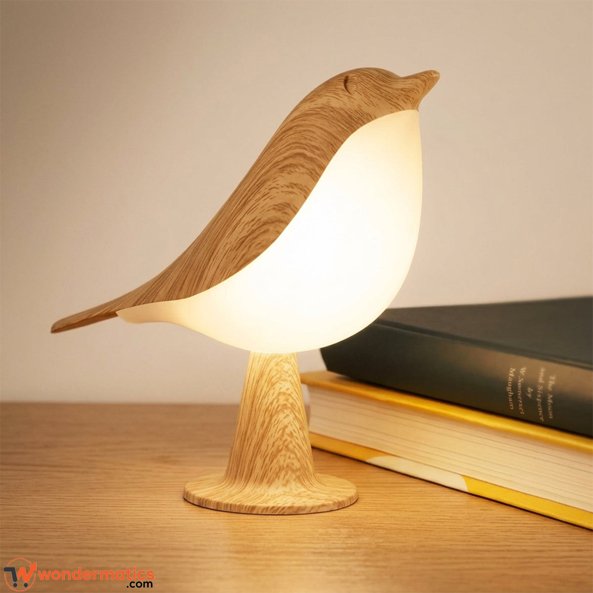 Bird shaped LED night light with wood grain finish glowing softly