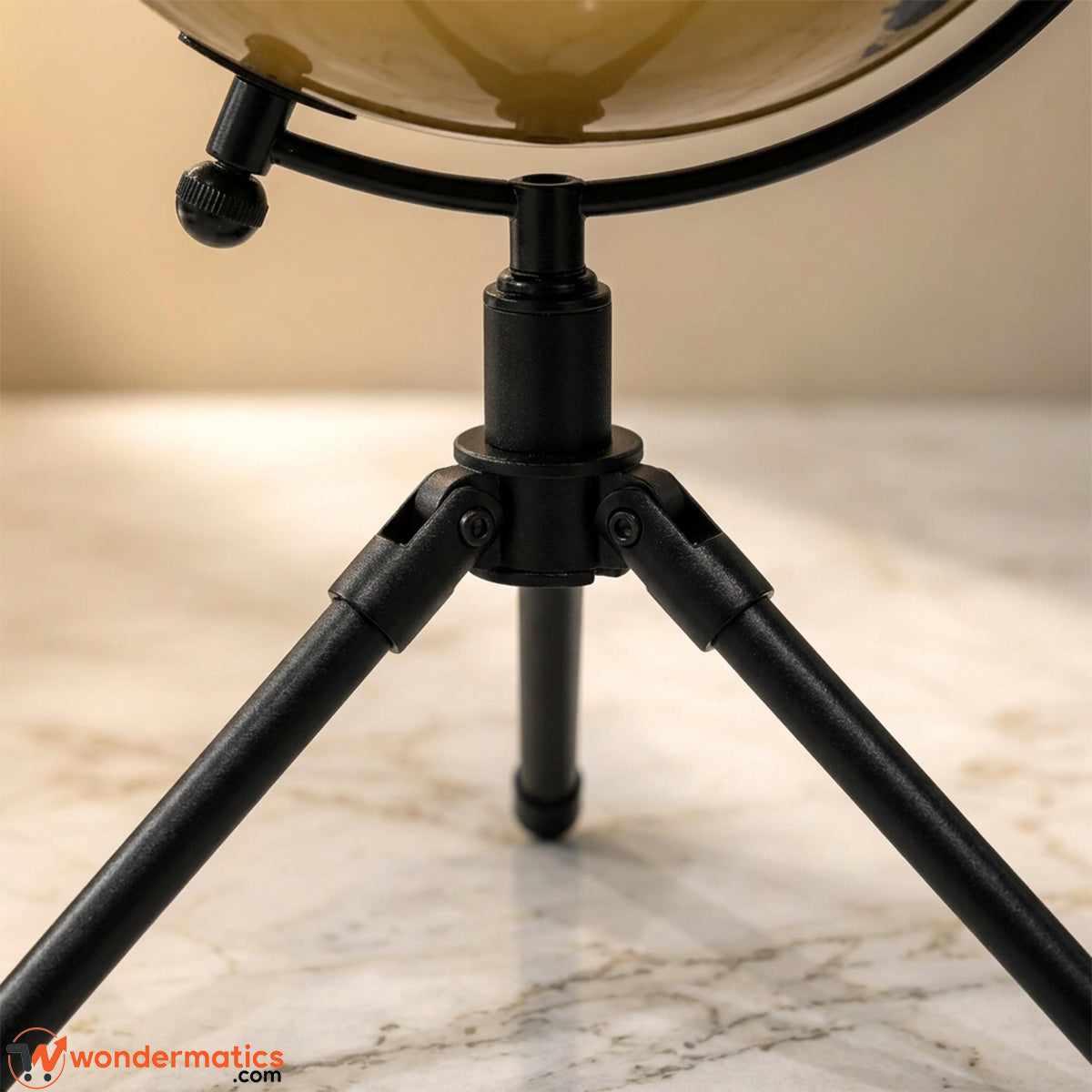 Black tripod stand base of decorative world globe
