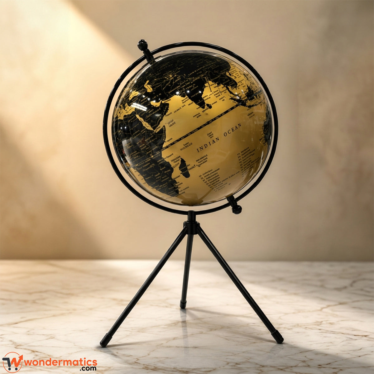 Black and gold decorative world globe on black tripod stand
