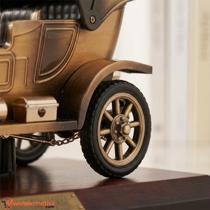 Closeup of wind up key mechanism on vintage car music box