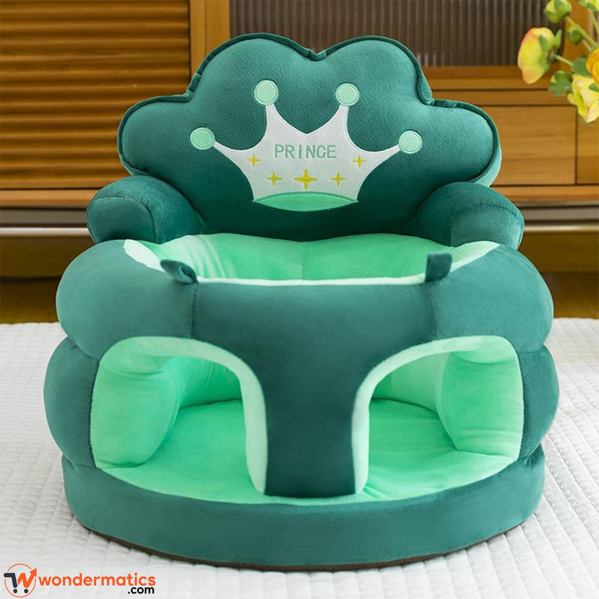 Front view of plush crown baby sofa seat for infants green color
