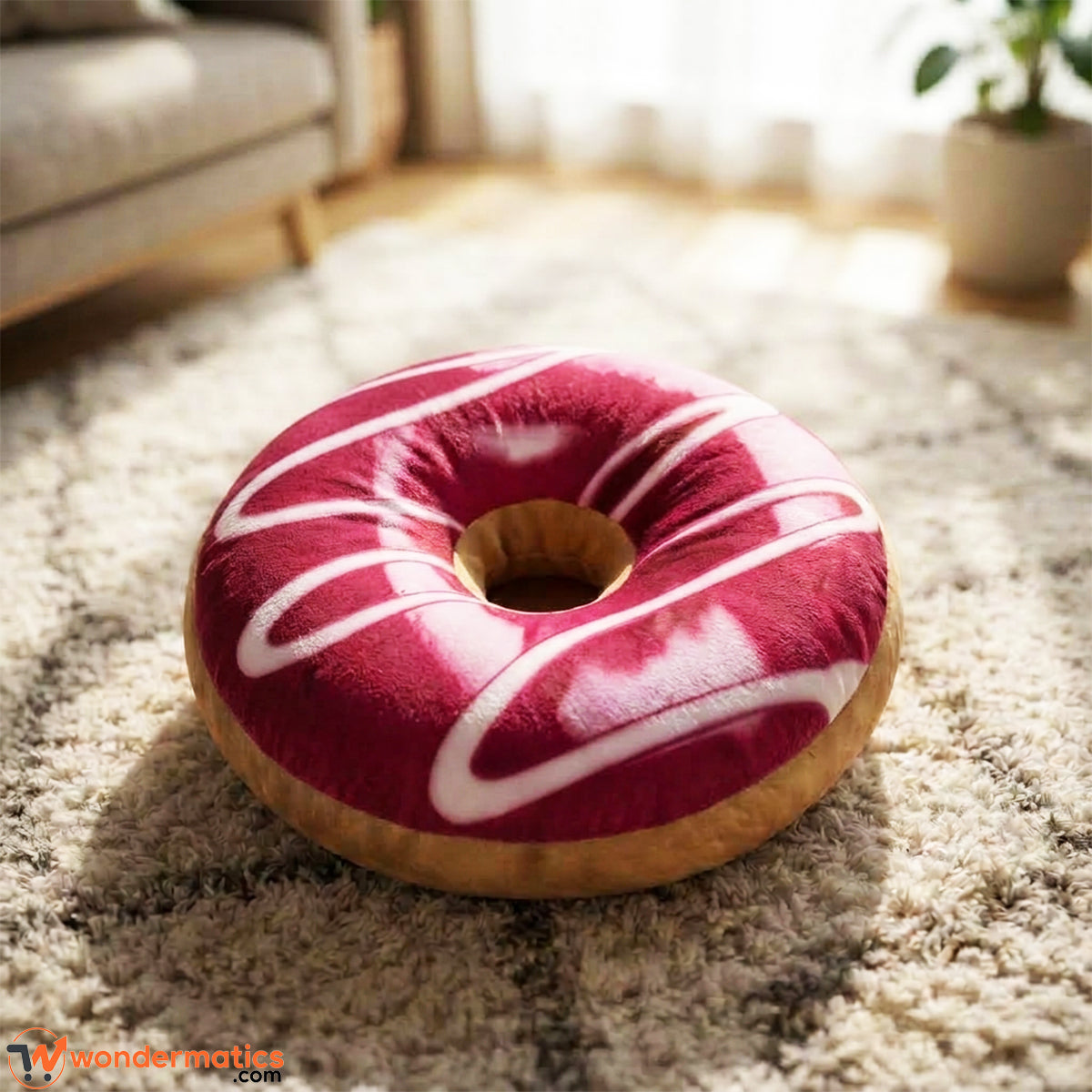 Front view of round donut shaped plush floor cushion maroon color