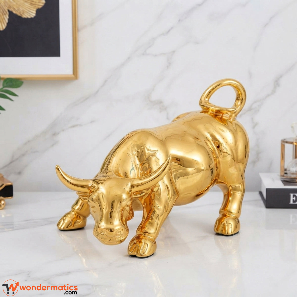 Gold charging bull figurine styled as decor on an office desk