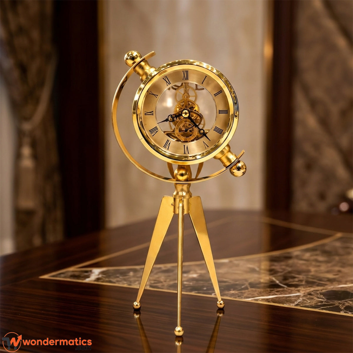 A gold-finished mechanical globe clock on a tripod stand, displayed on a polished dark wood table with a marble inlay. The clock features a transparent glass dome showing the inner gears and Roman numerals on the face.