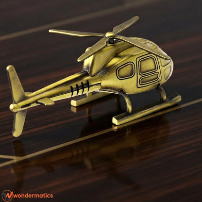 Brass finish helicopter showpiece displayed on office desk