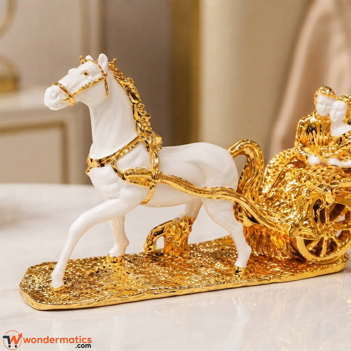 Close-up of the gold-plated detailing on the carriage and horse figures