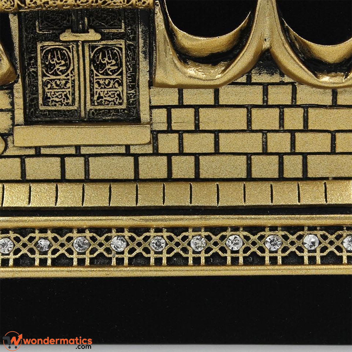 Close-up of sparkling rhinestone-embellished base on Kaaba showpiece