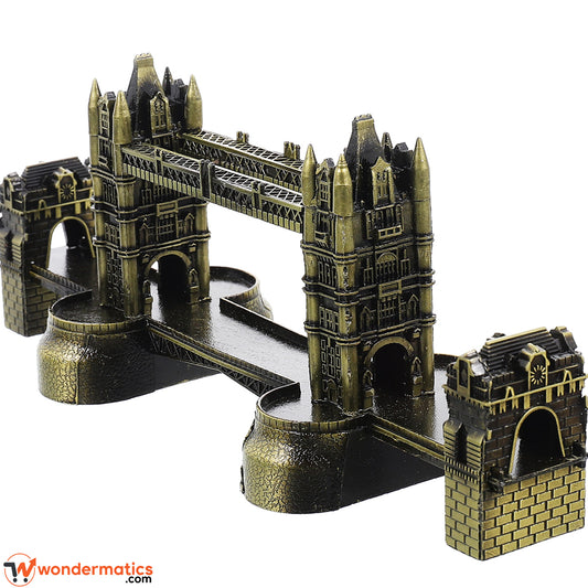 A miniature metal model of London's Tower Bridge, featuring an antique bronze and gold finish, displayed on a clean white background with a WonderMatics watermark.