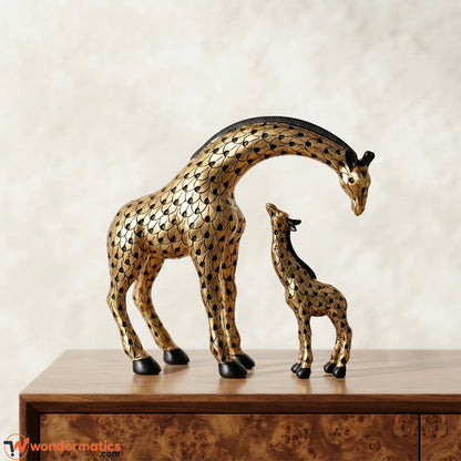 Mother and child giraffe figurine set in gold with black scale pattern