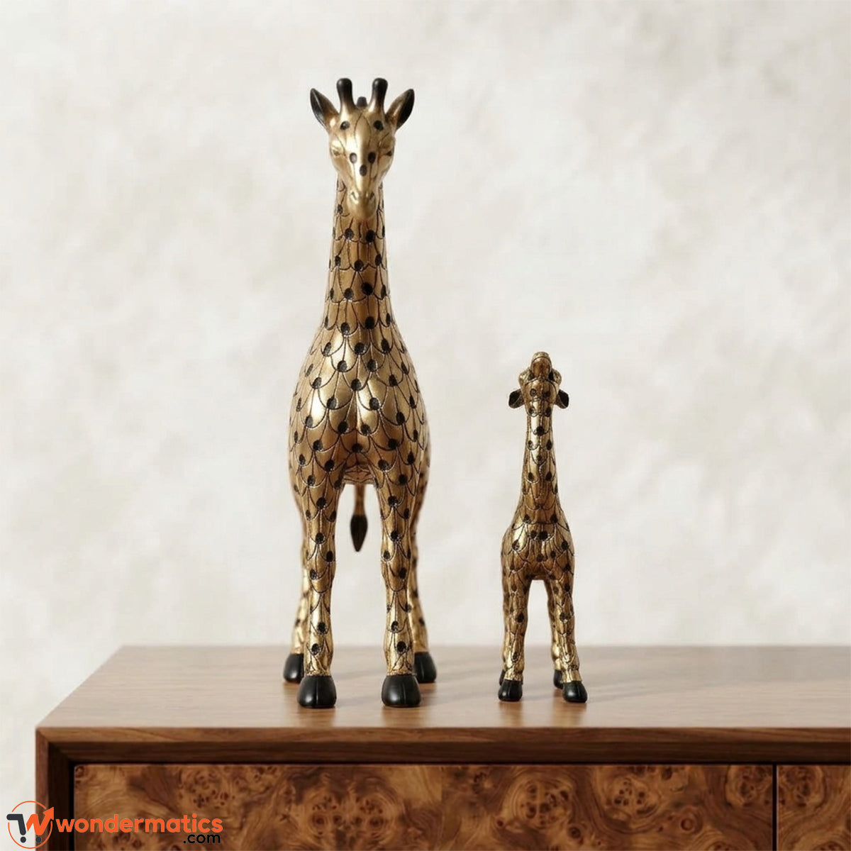 Front view of gold mother giraffe and calf figurines with black scale etching