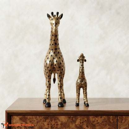Front view of gold mother giraffe and calf figurines with black scale etching