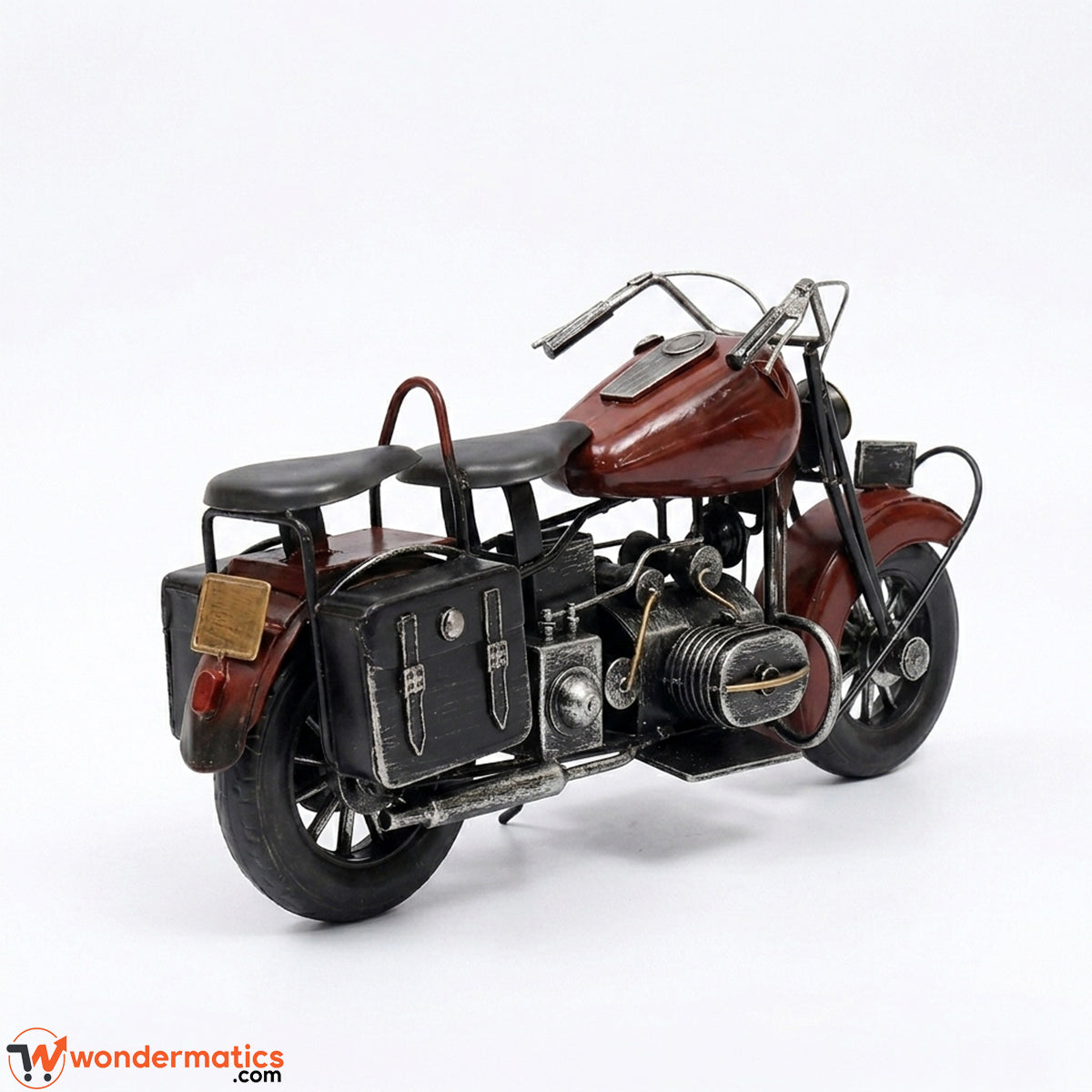 Detail view of wheels and frame on vintage metal motorbike model