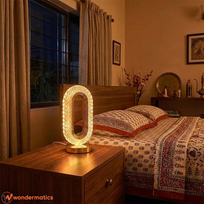 Crystal touch lamp glowing softly on bedroom nightstand