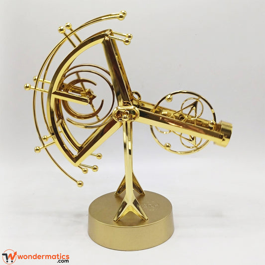 Metallic gold perpetual motion physics model illustrating mechanical motion principles as a scientific desktop instrument