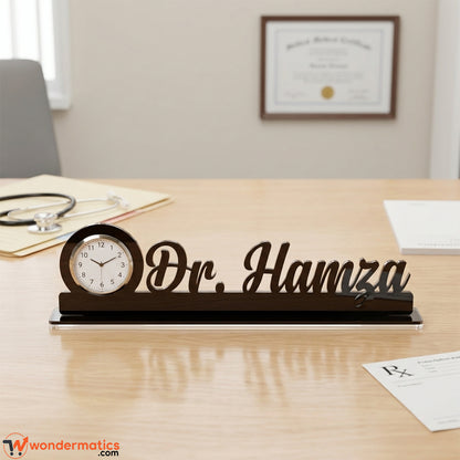 Front view of a custom black acrylic dr name clock with a clock 