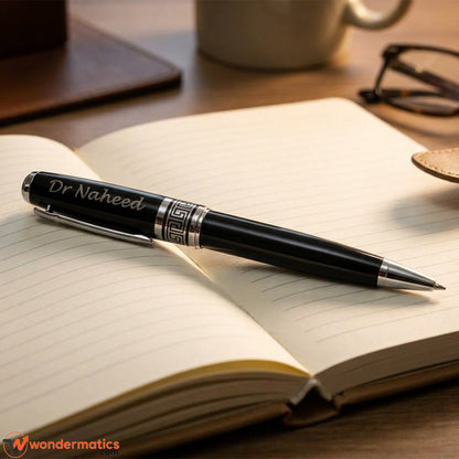 Engraved name pen placed on office desk with notebook