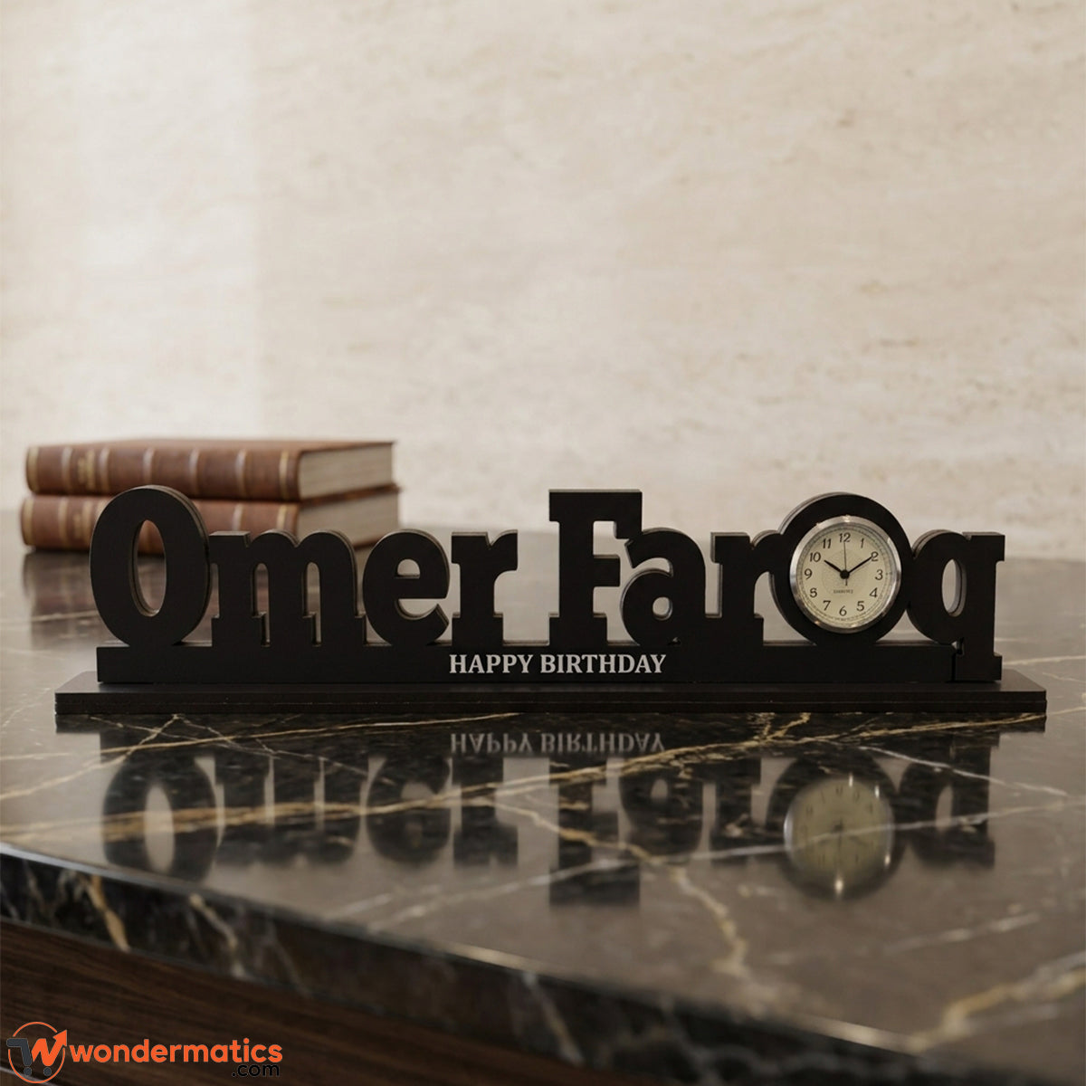 Engraved tagline detail on the base of a personalized acrylic name clock