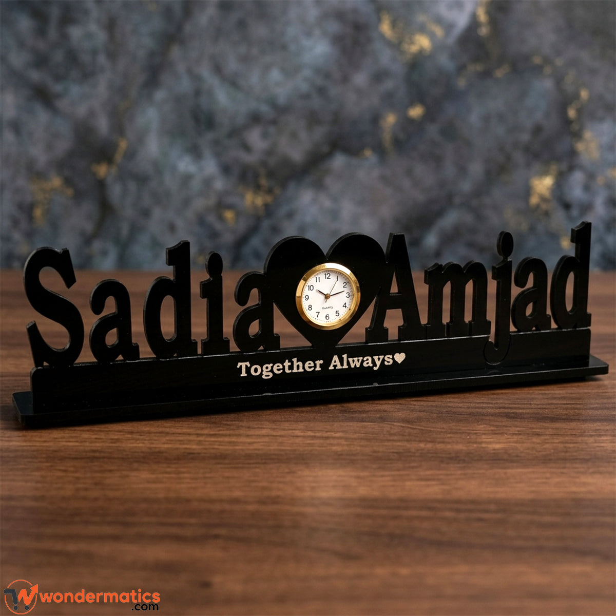 Close-up of the heart-shaped clock face on a personalized acrylic table clock, heart in center clock