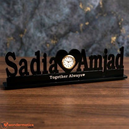 Close-up of the heart-shaped clock face on a personalized acrylic table clock, heart in center clock