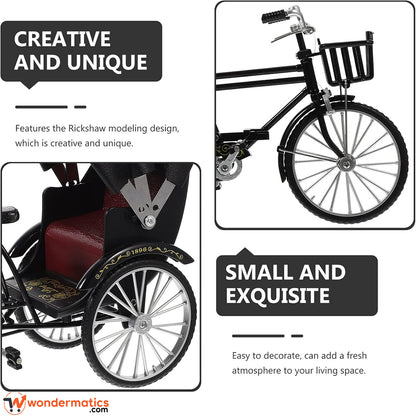 A promotional graphic for a miniature black Rickshaw-style carriage with silver spoked wheels, shown in two detail panels on a white background with marketing text. The top-right panel shows the front basket and handlebar area, and the bottom-left panel shows the side with the red upholstered seat and large wheel.