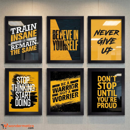 Six framed motivational wall art prints arranged in a 2x3 grid on a light gray wall. The prints feature bold black, yellow, and white typography with phrases such as 'TRAIN INSANE OR REMAIN THE SAME,' 'BELIEVE IN YOURSELF,' 'NEVER GIVE UP,' 'STOP THINKING START DOING,' 'BE A WARRIOR NOT A WORRIER,' and 'DON'T STOP UNTIL YOU'RE PROUD.