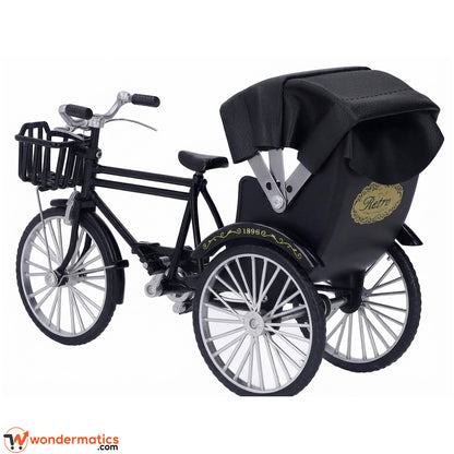Back view of a retro metal 3 wheel rickshaw model