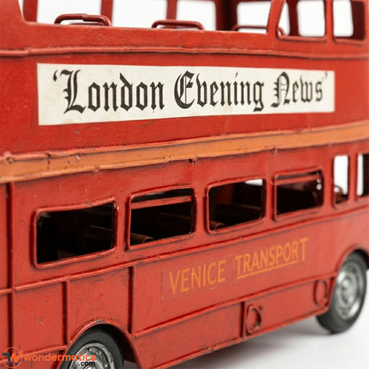 Close-up of vintage destination board and decorative livery detail on handmade London bus model