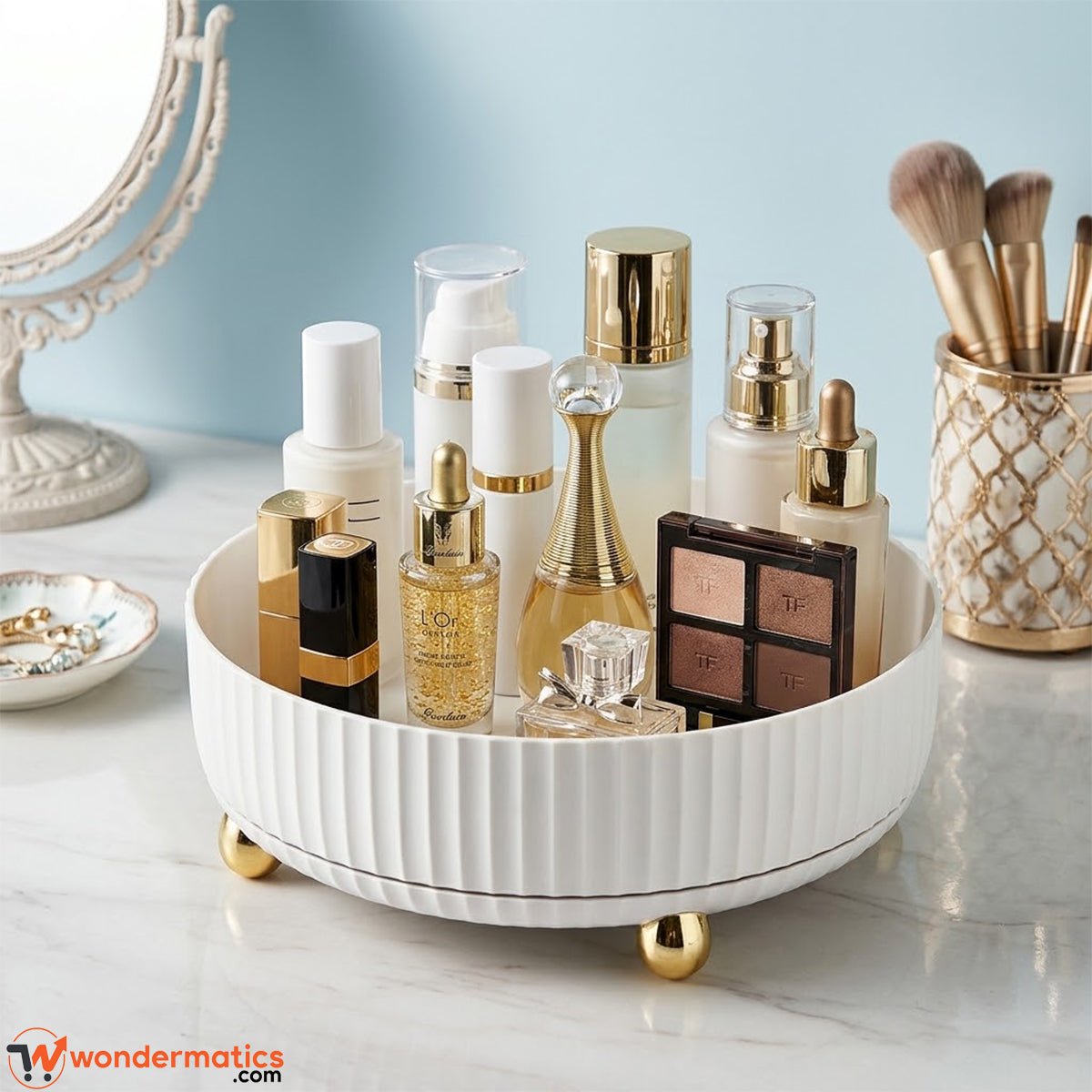 White round rotating organizer tray with gold-toned feet