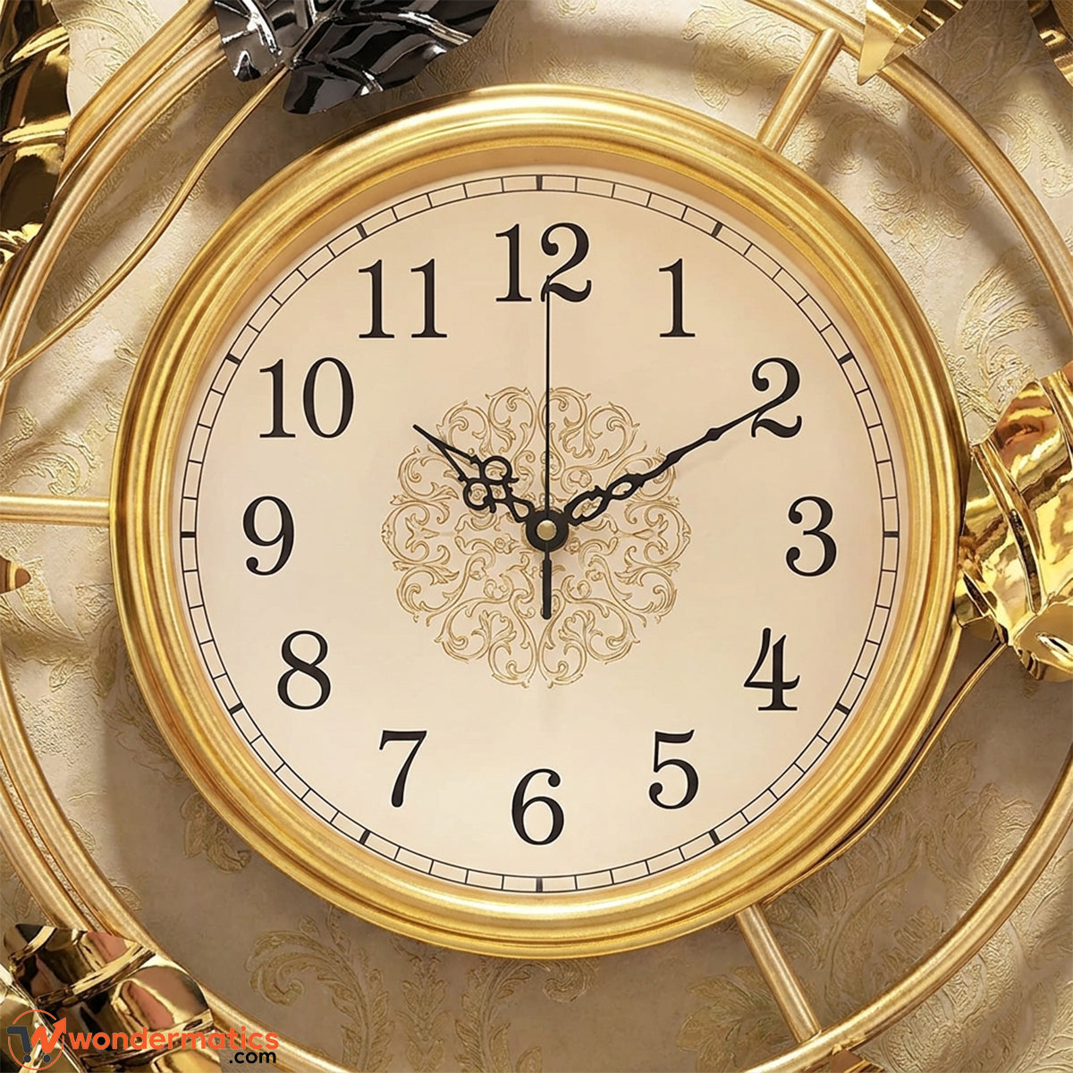 Close-up of gold-rimmed analog dial on luxury floral wall clock