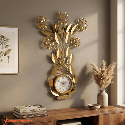 Side angle view of gold metal wall clock showing dimensional leaf design