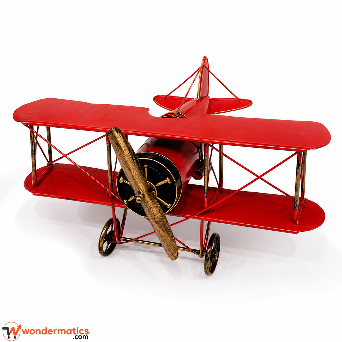 Side angle view of red metal biplane showing wing and propeller detail