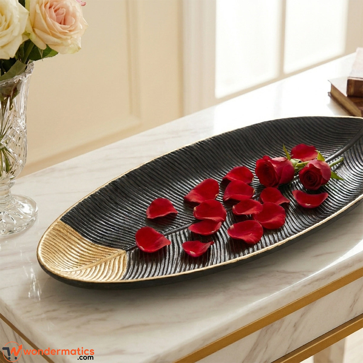 Closeup of leaf shape design and gold detailing on wooden decorative tray
